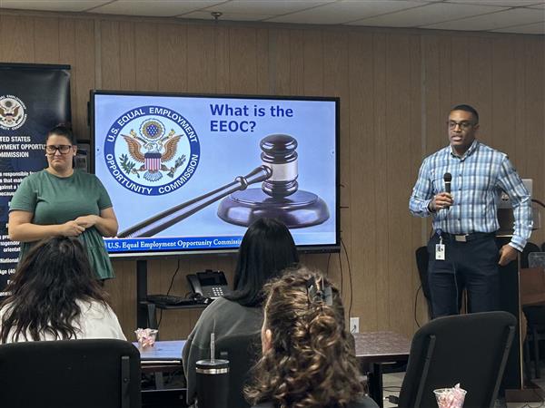 AIDB Birmingham Interpreter Coordinator Emily Cain interprets for a workshop on Employment Discrimination with Federal investigator Cortise Miles.